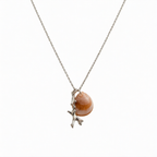 Silver coral pendant by Chorthip featuring a detailed, handcrafted coral-shaped design on a sleek silver chain.