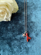 Silver starfish charm pendant by Chorthip featuring a detailed starfish design on a sleek silver pendant.