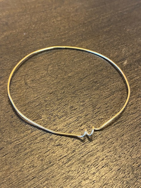 Chorthip Helix Spiral Bangle earrings featuring sleek, twisted metal design with a modern spiral shape.