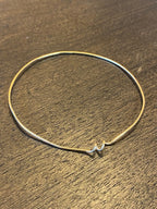 Chorthip Helix Spiral Bangle earrings featuring sleek, twisted metal design with a modern spiral shape.