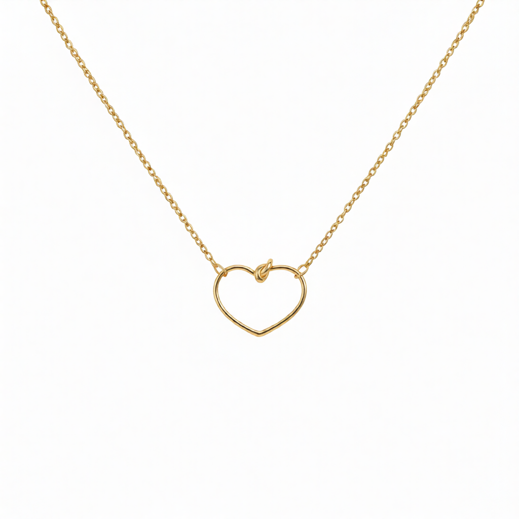 Silver Heart Knot Pendant by Chorthip featuring a delicate intertwined heart design on a fine chain.