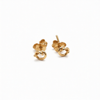 Chorthip Love Knot Earrings featuring intertwined metal loops, elegant jewelry accessory for pierced ears.
