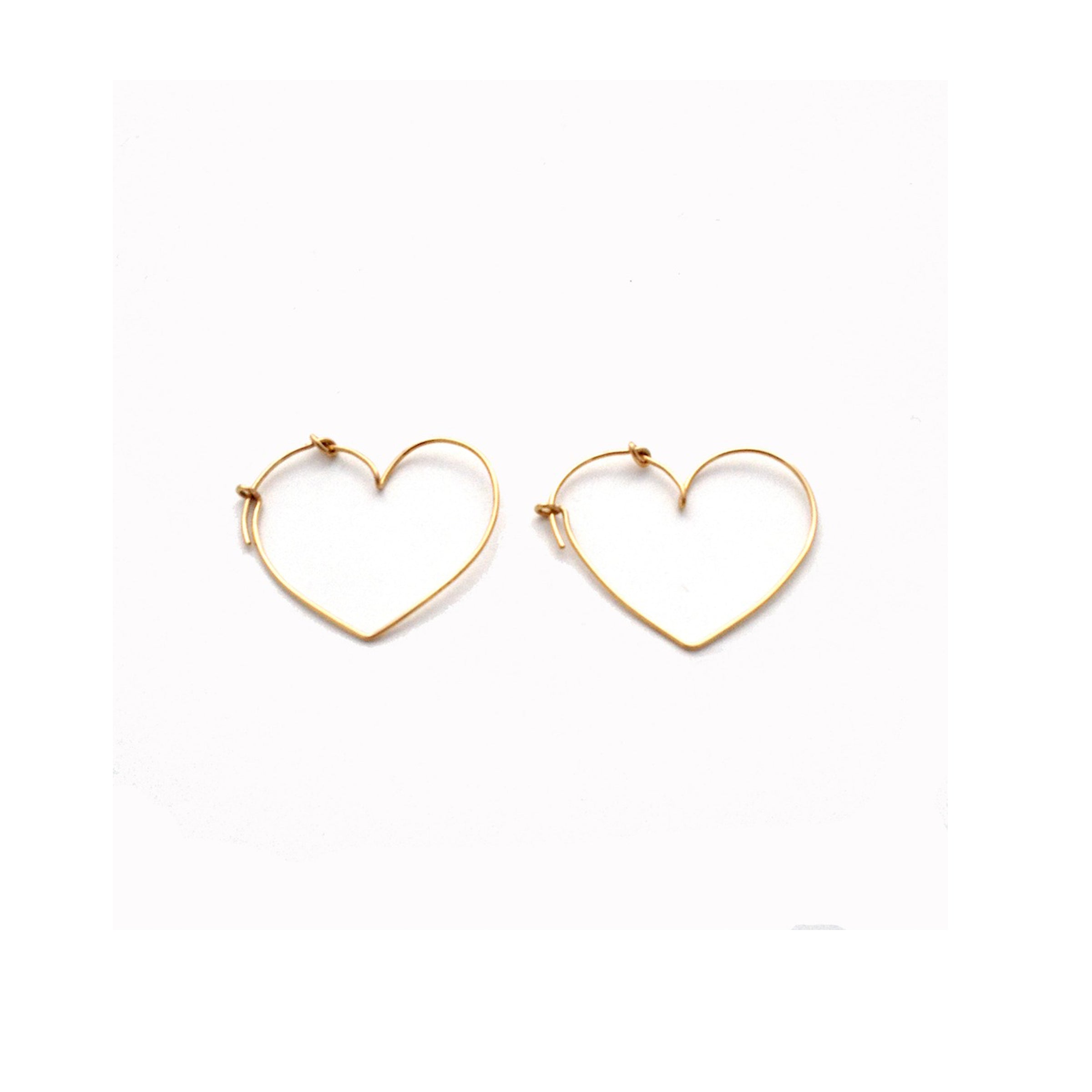 Small gold heart hoop earrings by Chorthip featuring a knot design for a delicate and stylish jewelry look.