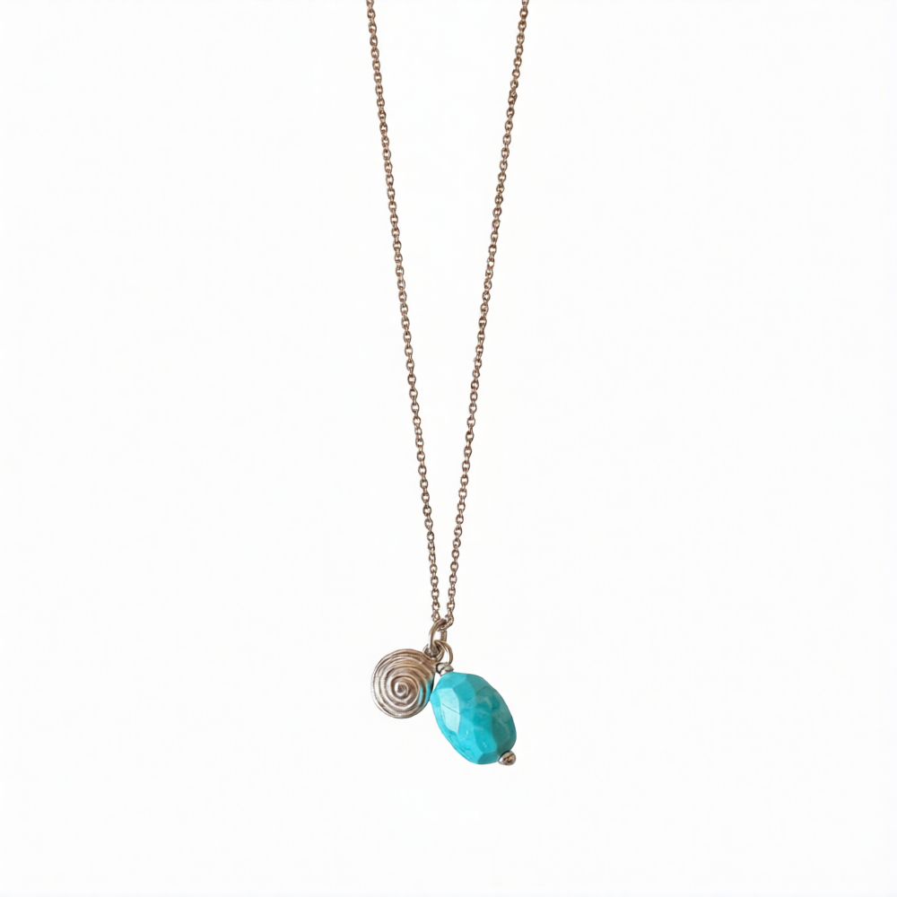 Silver spiral pendant with turquoise stone charm, featuring a stylish design by Chorthip for jewelry or accessory use.