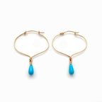 Chorthip lotus knot hoop earrings with dangling Sleeping Beauty turquoise drop stones, elegant jewelry for pierced ears.
