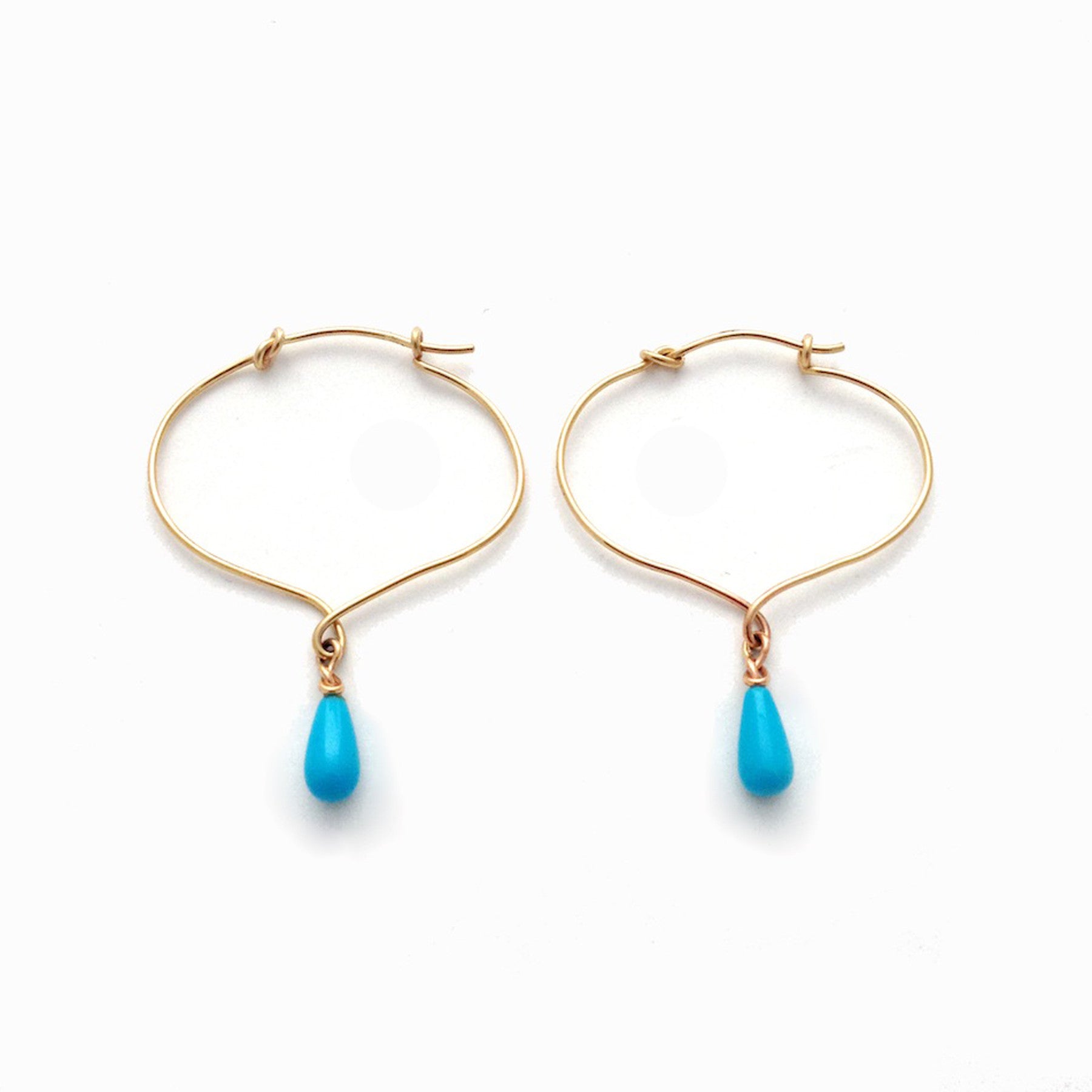 Chorthip lotus knot hoop earrings with dangling Sleeping Beauty turquoise drop stones, elegant jewelry for pierced ears.