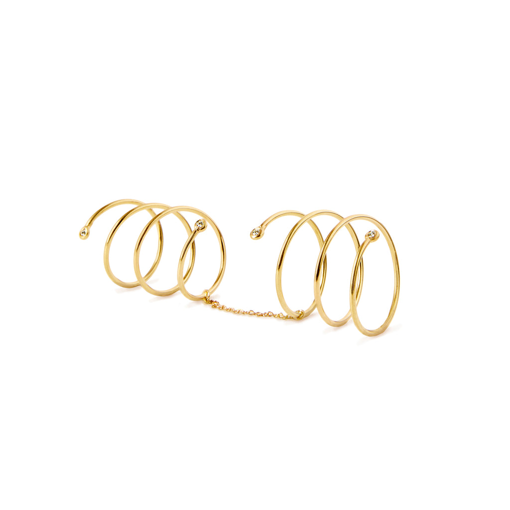 Pair of Helix Double Spiral Rings by Chorthip, showcasing shiny silver finish and intricate double spiral design on a plain background.