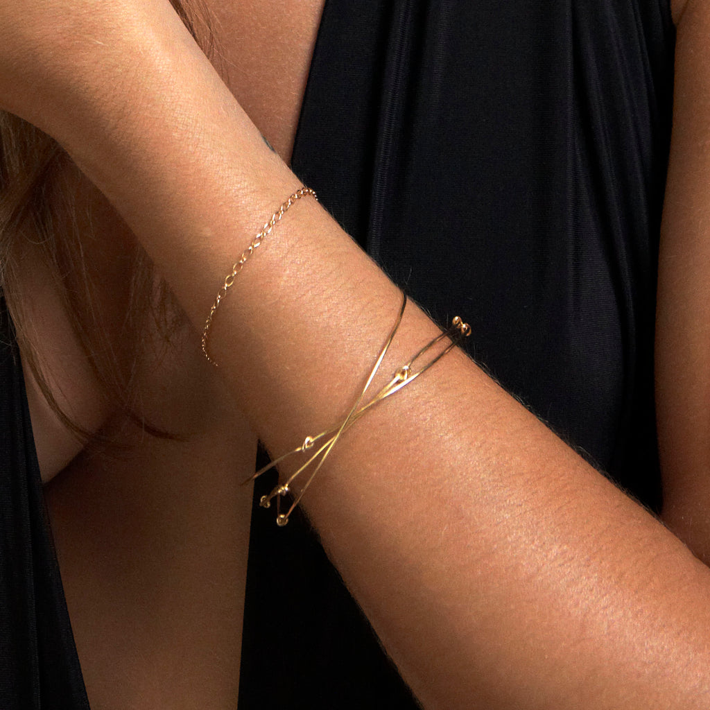 Chorthip single knot bangle made of sleek metal, showcasing a minimalist design with smooth, polished finish.