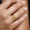 Chorthip Love Knot Ring featuring a delicate intertwined heart design, showcasing elegant craftsmanship in a stylish ring.