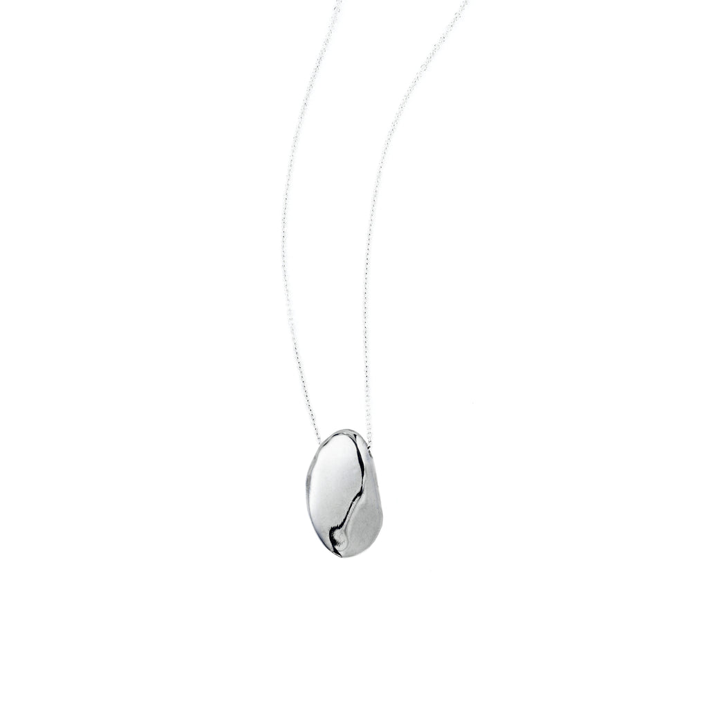 Chorthip Pebble Stone Pendant featuring a smooth, rounded stone design on a delicate chain.