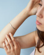 Chorthip Raindrop Bangle with sleek, polished design, featuring a smooth, rounded shape perfect for elegant wristwear.