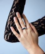 Elongated pebble ring by Chorthip featuring a sleek, smooth design with an organic pebble shape in sterling silver.