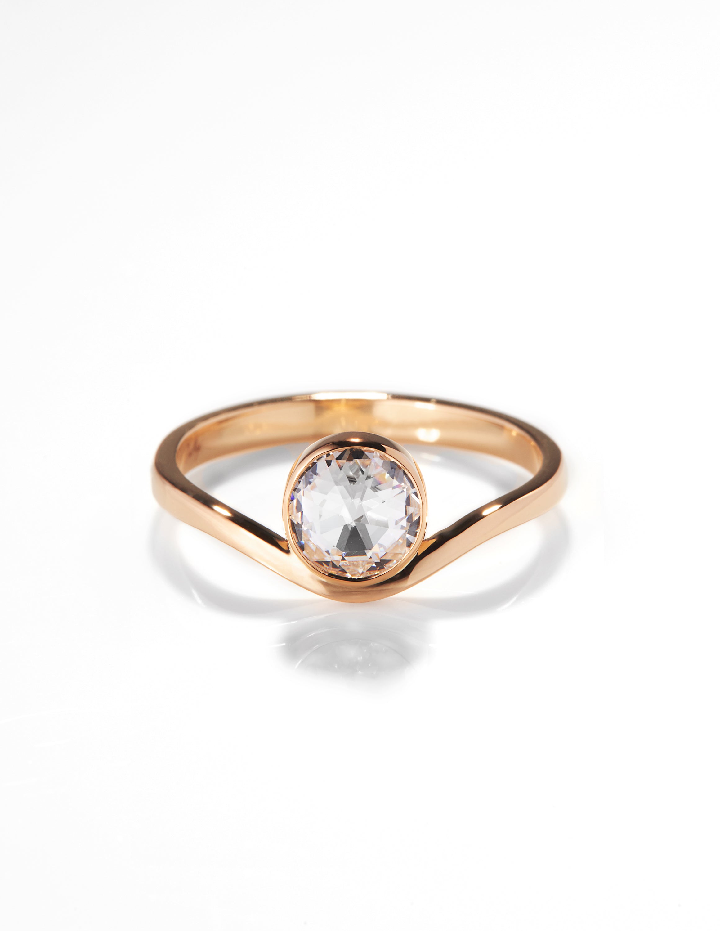 Chorthip Arisa Wave engagement ring featuring a sleek band with a wave design and sparkling gemstones.
