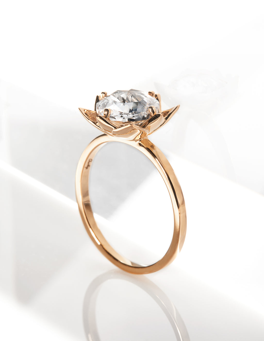 Elegant Arisa Rose Engagement Ring by Chorthip featuring a delicate rose-shaped design and sparkling gemstone setting.