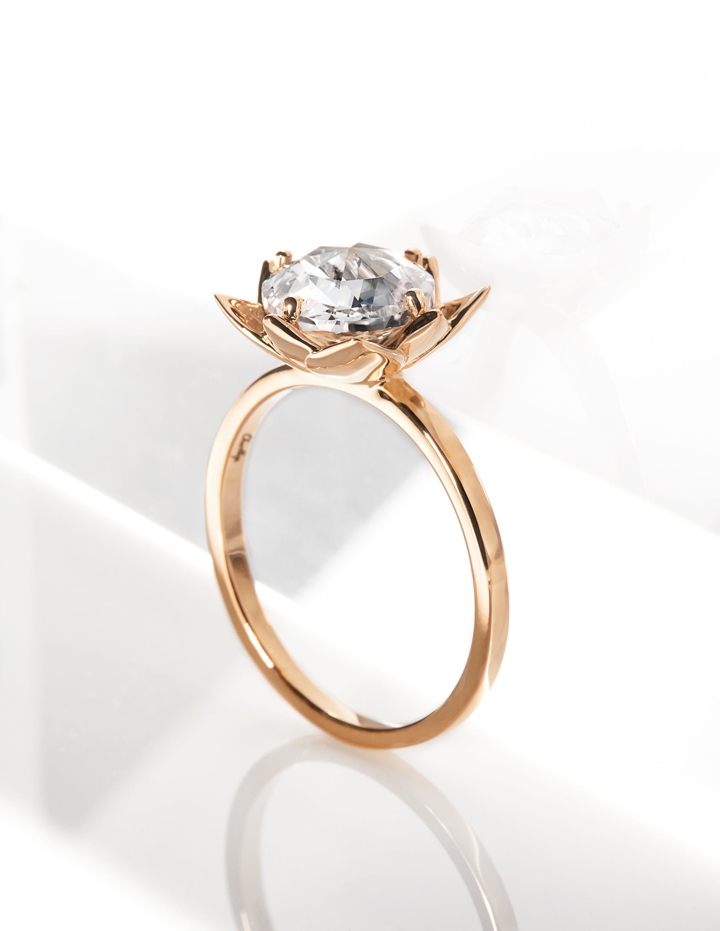 Elegant Arisa Rose Engagement Ring by Chorthip featuring a delicate rose-shaped design and sparkling gemstone setting.
