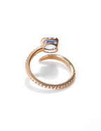 Elegant Arisa Serpentine Engagement Ring by Chorthip featuring a twisted band and sparkling gemstone setting.