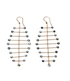 Pair of Arisa Azure Mobile Earrings by Chorthip featuring elegant silver hooks and vibrant blue gemstone accents.