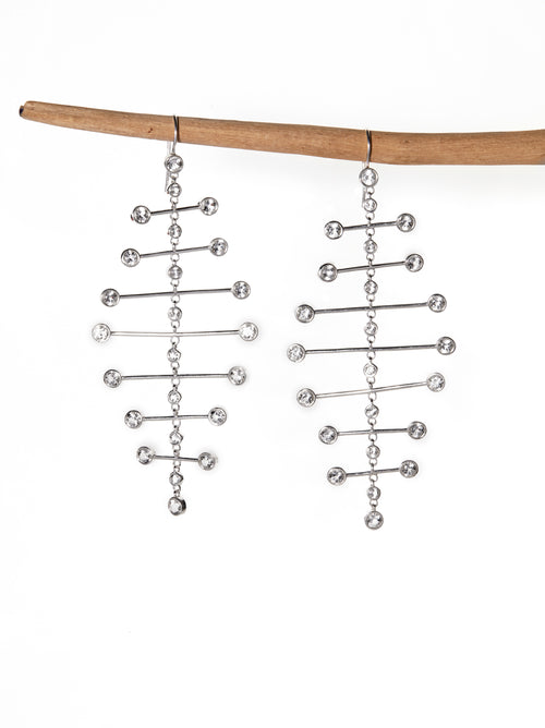 Chorthip Arisa Twilight Mobile Earrings featuring delicate silver hoops with twilight-inspired dangling charms.