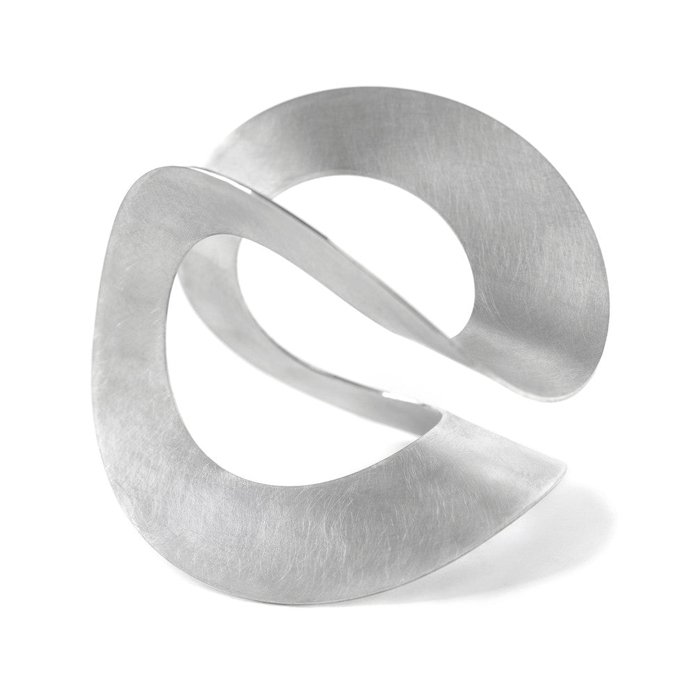 Chorthip Möbius Bangle featuring a sleek, modern design with a smooth, polished surface and open circular shape.