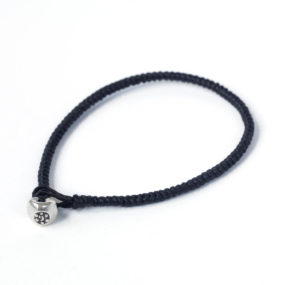 Silver nugget bracelet by Chorthip featuring black metallic nuggets on a delicate bracelet chain.
