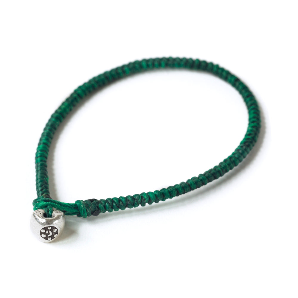 Silver Nugget Bracelet by Chorthip featuring green gemstone nuggets and a sleek silver clasp on a white background.