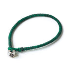 Silver Nugget Bracelet by Chorthip featuring green gemstone nuggets and a sleek silver clasp on a white background.