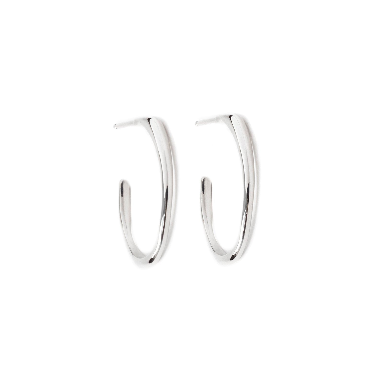Small Raindrop Hoop Earrings by Chorthip featuring delicate silver hoops with raindrop-shaped charms.