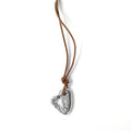 Chorthip stone heart pendant with a polished, natural stone heart shape hanging from a silver chain.