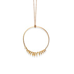 Closeup of Chorthip Helix Circle Pendant showing its spiral design and polished silver finish.