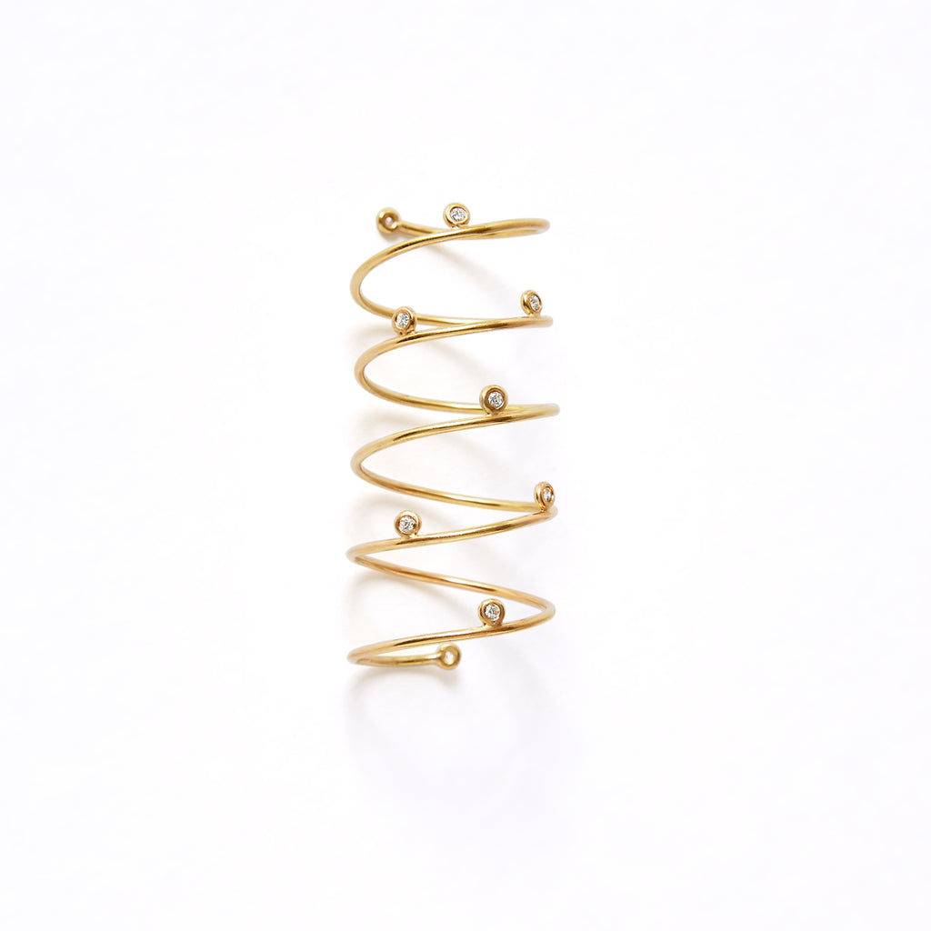 Silver Helix Spiral Ring by Chorthip, showcasing a sleek, twisted design with a polished finish on a neutral background.