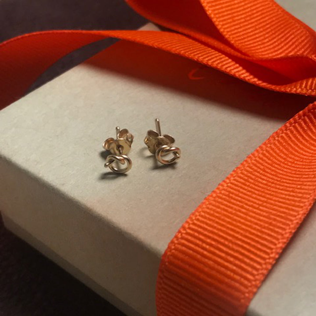 Elegant 18k gold Love Knot earrings by Chorthip featuring interwoven knot design for a sophisticated look.