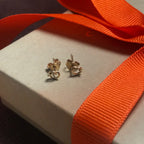 Elegant 18k gold Love Knot earrings by Chorthip featuring interwoven knot design for a sophisticated look.
