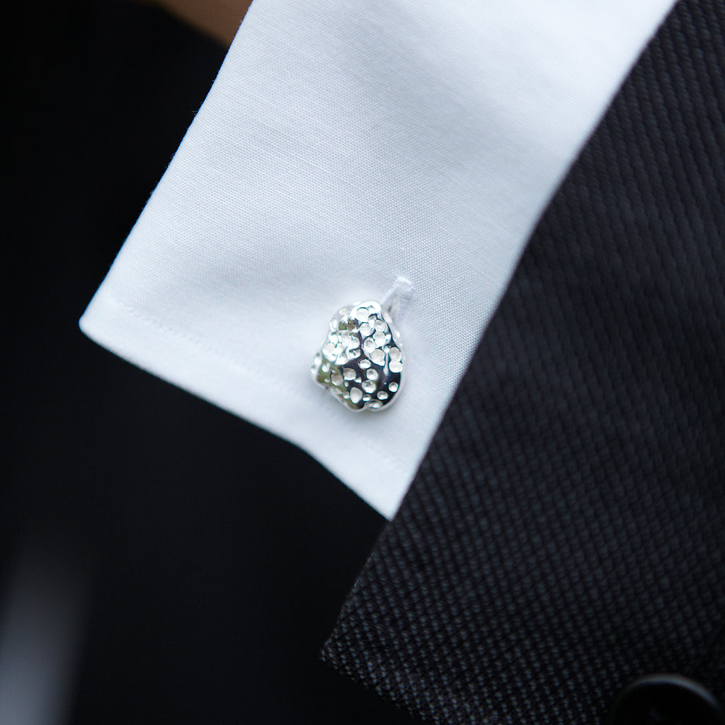 Chorthip Lava Stone cufflinks with round black volcanic stone and silver-tone setting, stylish men's accessory.