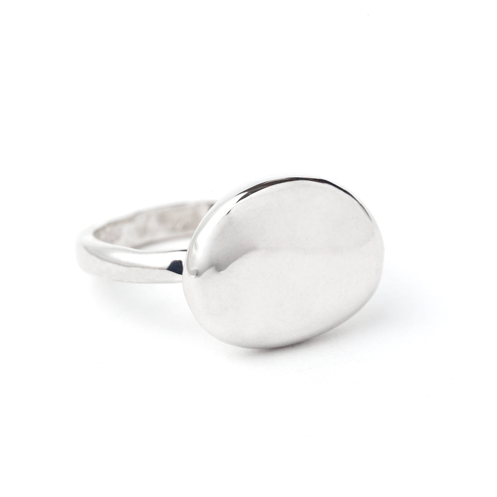 Round pebble stone ring by Chorthip featuring a textured design and smooth, natural stone appearance.