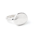 Round pebble stone ring by Chorthip featuring a textured design and smooth, natural stone appearance.