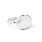 Round pebble stone ring by Chorthip featuring a textured design and smooth, natural stone appearance.