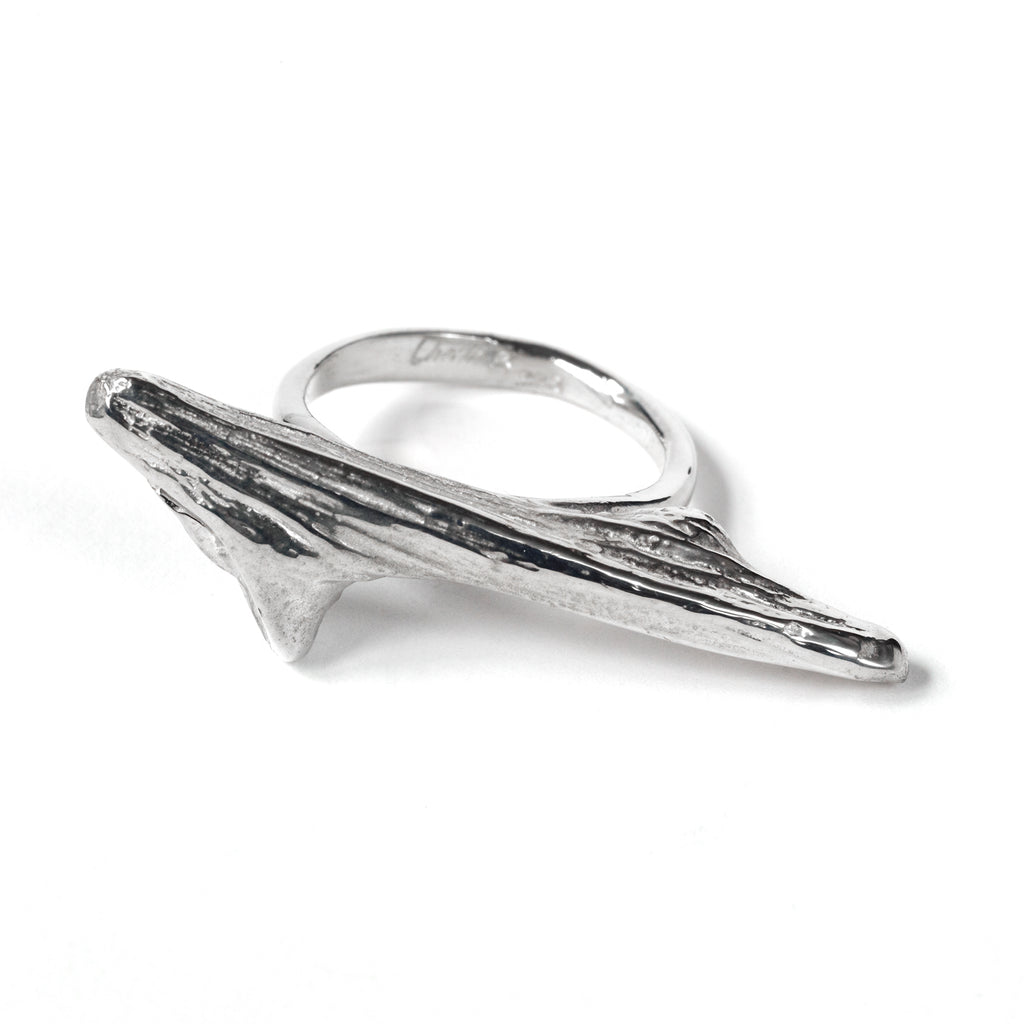 Close-up of a Chorthip Drift Wood Ring showcasing its natural, textured wooden design on a plain background.