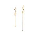 Chorthip Helix Spiral Drop Earrings with sleek, twisting silver design hanging from earlobes.