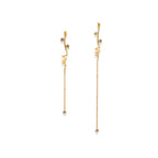 Chorthip Helix Spiral Drop Earrings with sleek, twisting silver design hanging from earlobes.