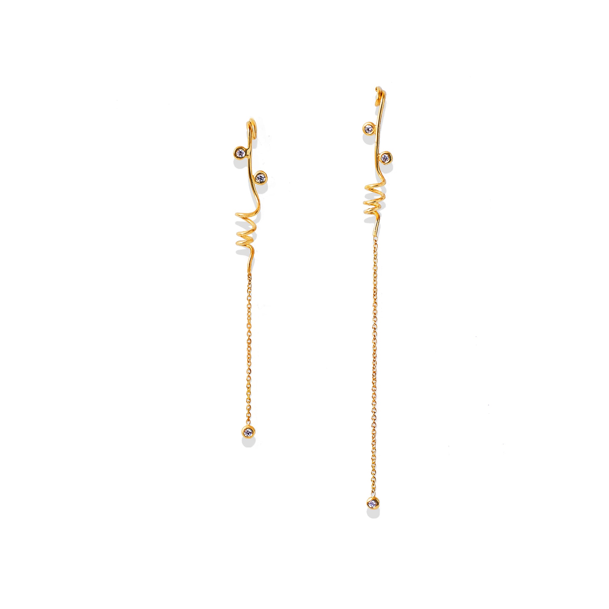 Chorthip Helix Spiral Drop Earrings with sleek, twisting silver design hanging from earlobes.