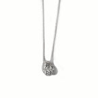 Chorthip lava stone pendant hanging on a chain, showcasing its textured, volcanic surface and dark, earthy tones.