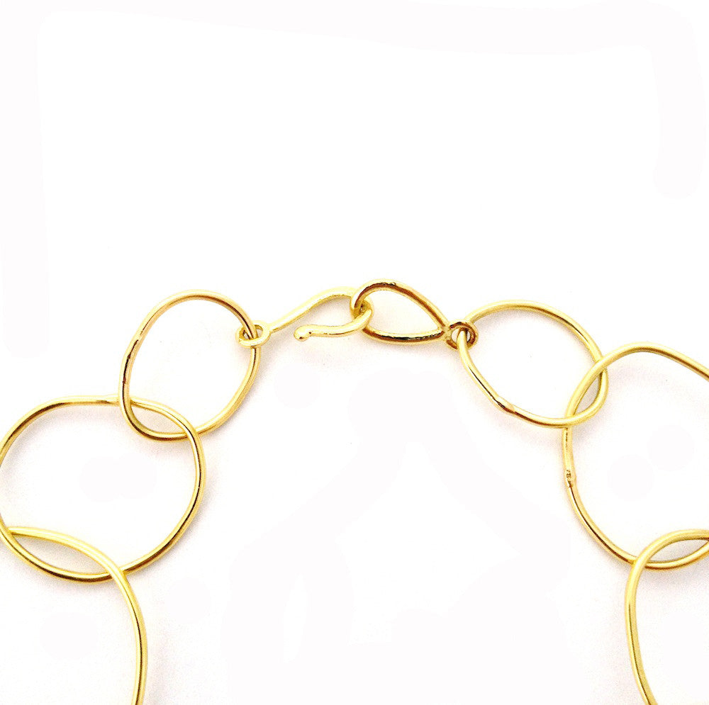 Chorthip URS Link Gold Bracelet with wave link design, showcasing its elegant and polished gold finish.