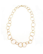 Chorthip URS Link Gold Necklace, 24-inch wave-style chain, showcasing shiny gold links on a plain background.