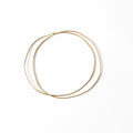 Chorthip Double Link URS Gold Bangle featuring a sleek, interconnected wave design in polished gold finish.
