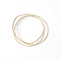 Chorthip Triple Link URS Gold Bangle with three interconnected wave-shaped links in polished gold finish.