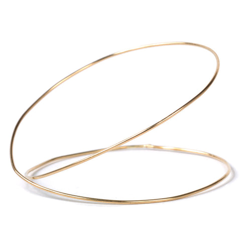 Pair of Chorthip double spiral URS gold bangles with intricate gold designs, perfect for elegant wrist jewelry.